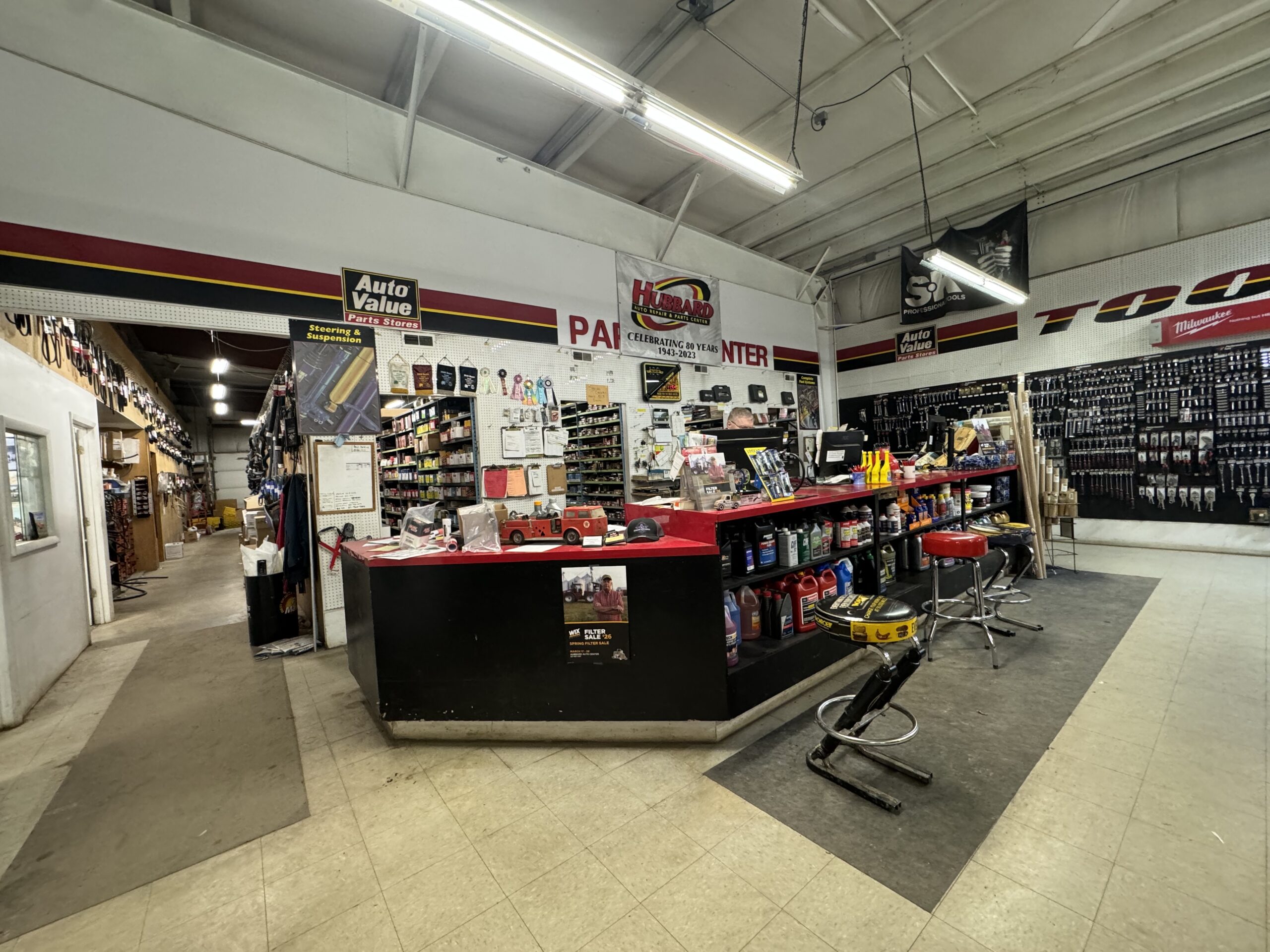 Hubbard Auto Parts store interior with checkout counter and Auto Value signage